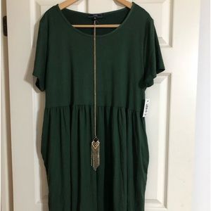Green dress with pockets with tags.